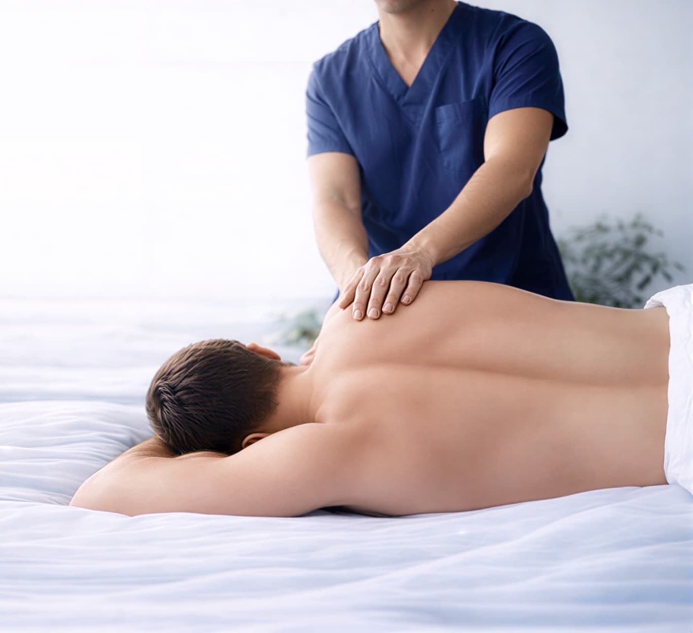 Mobile massage therapist delivering home visit in West London